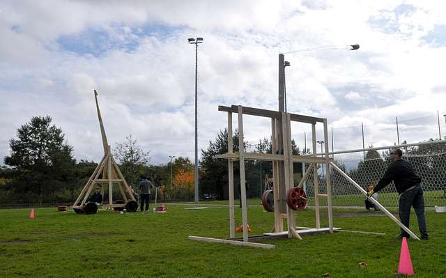a catapult launching a pumpkin